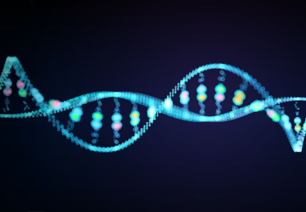 Abstract illustration of a glowing DNA double helix made of blue and multicolored light particles on a dark background.